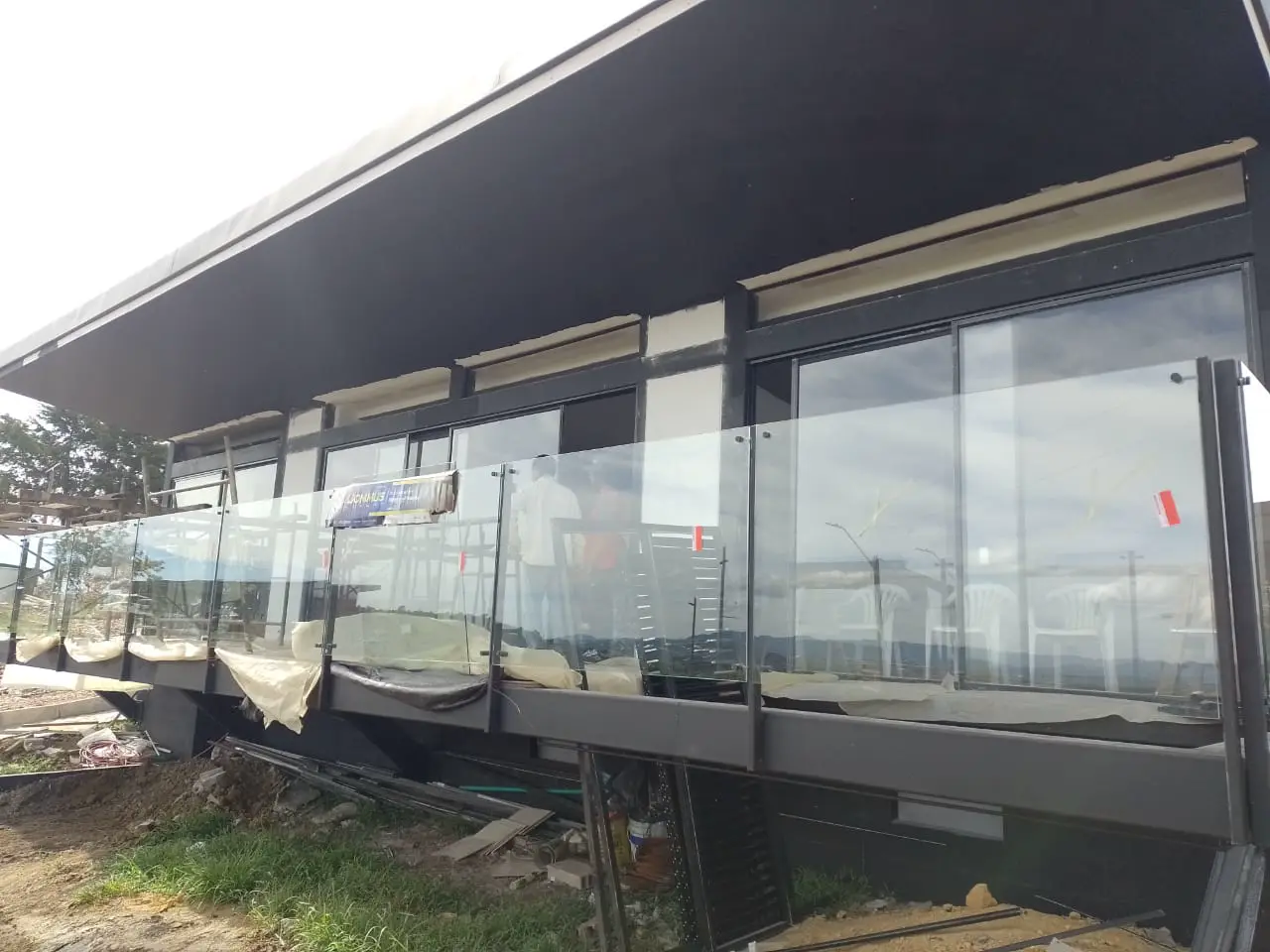Glass-walled structure with a dark metal frame