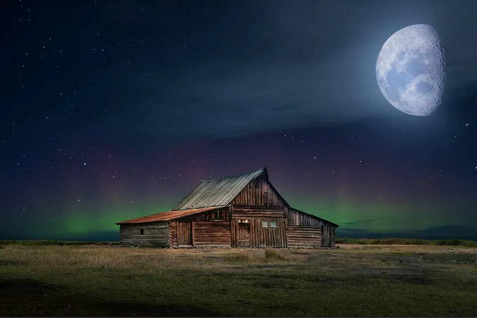 Night sky over a wooden cabin